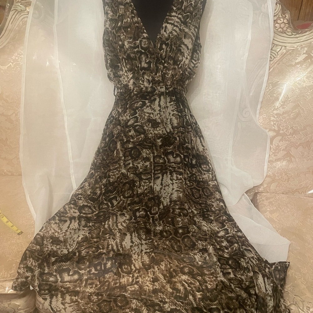 Flowy dress in size Medium. Side zipper closure. New with tags